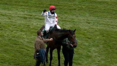 Harry Skelton celebrates atop Protektorat, after winning the SSS Super Alloys Manifesto Novices' Chase. AP