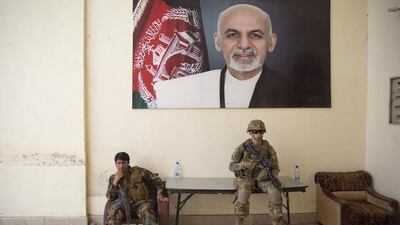 Afghan and US soldiers on guard in the governor’s compound in Kandahar, Afghanistan on August 4, 2016. Massoud Hossaini / AP Photo