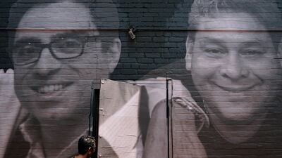 A mural in Washington shows Iranian-American citizen Siamak Namazi, left, who has held in Iran since 2015. AP