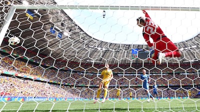 Ukraine's Andriy Lunin after the ball hit the crossbar from a corner kick taken by Romania's Nicolae Stanciu. Reuters