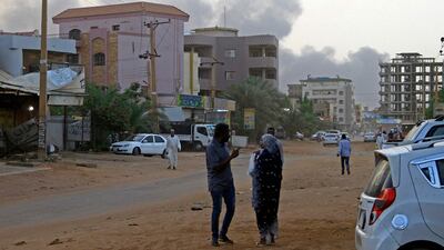 Smoke billows above residential buildings in Khartoum, as fighting in Sudan raged for a second day. AFP