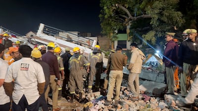 Police officers and rescue workers after the collapse. Reuters