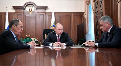 Russian President Vladimir Putin meets Russian Foreign Minister Sergey Lavrov and Defence Minister Sergei Shoigu and announces Russia will abandon the 1987 Intermediate-Range Nuclear Forces treaty. Pool via AP
