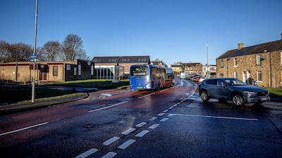 A bus drives through the streets of Winlaton. Charlotte Graham for The National