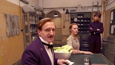 A handout photo showing (L-R) Ralph Fiennes, Saoirse Ronan, and Tony Revolori in "The Grand Budapest Hotel" (Courtesy: Fox Searchlight)