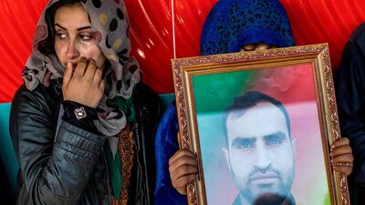 Relatives mourn at a funeral for two Syrian Democratic Forces (SDF) fighters in the Syrian Kurdish-majority city of Qamishli, after they were killed by a Turkish military drone, according to Kurdish security officials. AFP