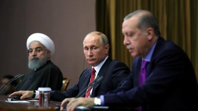 Iran's President Hassan Rouhani together with his counterparts Russia's Vladimir Putin and Turkey's Recep Tayyip Erdogan following a meeting in Sochi, Russia last November. Mikhail Klimentyev / Sputnik / Reuters
