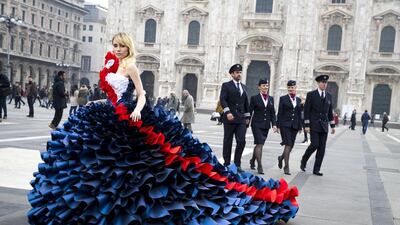 Model Suki Waterhouse poses in front of Milan's Duomo in a couture paper gown by Zoe Bradley. Courtesy of British Airways