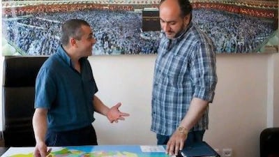 Ugur Pordogan, the general manager of a travel agency, shows areas where he sells properties to a customer from Damascus in Istanbul. He says there are Arab nationals buying properties in Turkey to make money, and others who are buying holiday homes.