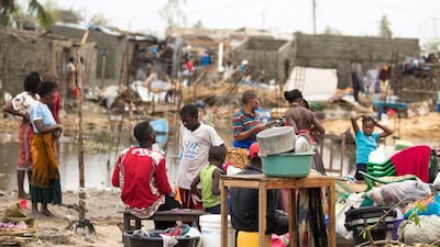 People salvaging iron sheets on the streets of Beira in Praia Nova, Beira, Mozambique. IFRC/EPA