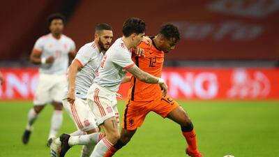 Owen Wijndal of Netherlands battles for possession with Hector Bellerin and Koke of Spain. Getty Images