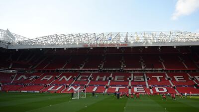 Barcelona's players attend a training session at Old Trafford stadium in Manchester, north west England on the eve of their UEFA Champions League quarter final first leg football match against Manchester United. AFP