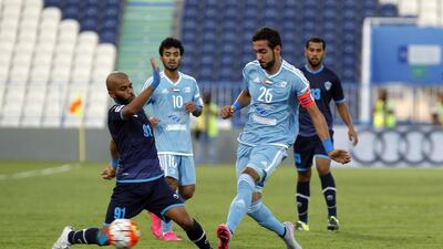 Dibba's Khalifa I ( left) challenges Y Jaber of Baniyas ( right ) for the ball. Host Baniyas would get two goals from Ishak Belfodil and another from Joaquin Larrivey on their way to a 3-0 win on Saturday. Jeffrey E Biteng / The National