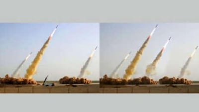 The photo on the left shows three missiles rising into the air while a fourth remains in the launcher on the ground during a test-firing. The photo on the right shows the same image, apparently digitally altered to replace the grounded missile and launcher with a fourth successfully launched missile.