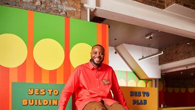 Designer Yinka Ilori in his Launderette of Dreams, which he's created with Lego. All photos: Lego