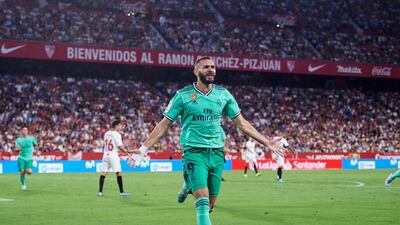 Karim Benzema celebrates after scoring against Sevilla. Getty Images