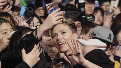 Actress Scarlett Johansson poses with fans for a selfie at a promotional event for her latest film, Ghost in the Shell, in Seoul, South Korea on March 17, 2017. The film will be released in the country on March 29. Ahn Young-joon / Associated Press
