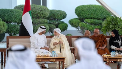 Sheikh Mohamed bin Zayed speaks with Shaykh Abdallah bin Bayyah (2nd L) during a Sea Palace barza. Seen with Dr Amal Al Qubaisi, Speaker of the Federal National Council (FNC) and delegates from the The Interfaith Alliance for Safer Communities Forum. Mohammed Al Hammadi / Ministry of Presidential Affairs