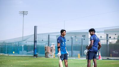 Adithya Shetty, left, with a teammate at ICC Academy. Reem Mohammed / The National