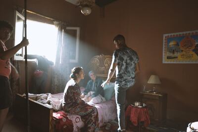 Director Anas Tolba, centre, Fatma Adel who plays Zahra, left, and Arfa Abdel Rassoul who plays Zakeya from the set of 'Between Two Seas'. Courtesy Anas Tolba