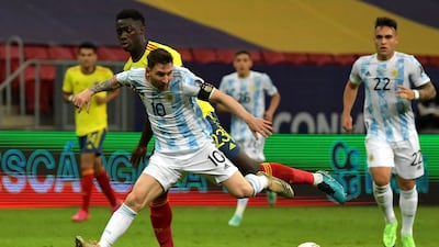Lionel Messi and Colombia's Davinson Sanchez vie for the ball.