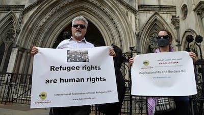 Refugee rights activists protest at the Royal Courts of Justice, London. Prince Charles is said to be unhappy over the UK government's policy to deport of asylum seekers from Britain to Rwanda. Reuters.