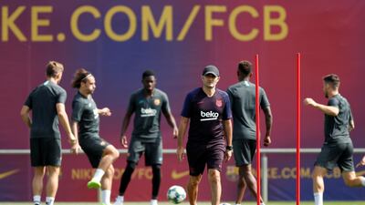 Barcelona coach Ernesto Valverde watches his players in training. Reuters