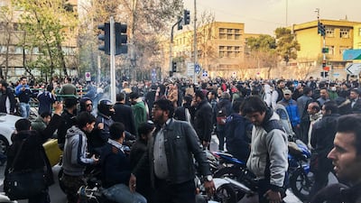 This photo shows people gathering to protest against Iran's weak economy in Tehran, Iran, on December 30. AP