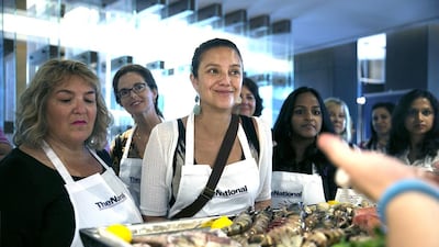 Guests take a peek at the ingredients prepared for their #healthyliving cooking experience. Silvia Razgova / The National