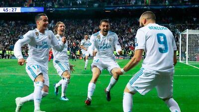 Karim Benzema celebrates with Real Madrid teammates after scoring his second goal during the Champions League semi-final against Bayern Munich. AFP/OSCAR DEL POZO