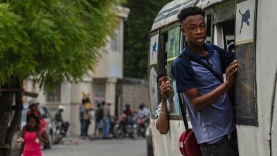 Passengers ride on a bus in downtown Port-au-Prince, Haiti, Friday, April 26. AP Photo