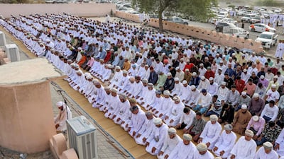 Worshippers perform the morning prayers for Eid al-Adha in the Surur district in Oman's governorate of Samail. AFP