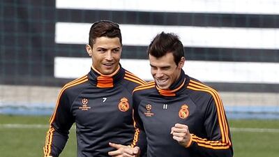 Real Madrid’s Cristiano Ronaldo, left, and Gareth Bale share a laugh during training on Tuesday. Both players will be fit for Wednesday night’s Uefa Champions League semi-final, first leg against Bayern Munich at the Bernabeu. Chema Moya / EPA