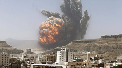 Smoke rises during an airstrike yesterday on a Yemeni army weapons depot on a mountain overlooking capital Sanaa. Khaled Abdullah / Reuters