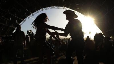 Stagecoach attendees dance near the Palomino stage during day two. Chris Pizzello / Invision / AP