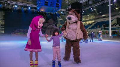 A girl skates with cast from Mash and The Bear On Ice. Photo courtesy Abu Dhabi Tourism & Culture Authority.