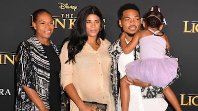 Chance The Rapper, wife Kirsten Corley and daughter Kensli Bennett arrive for the world premiere of Disney's 'The Lion King' at the Dolby Theatre on July 9, 2019. AFP