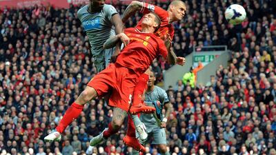 Newcastle United’s Shola Ameobi, left, in action with Liverpool’s Daniel Agger, centre, and Martin Skrtel during their English Premier League match at the Anfield Road, in Liverpool, Britain on May 11, 2014. EPA/PETER POWELL