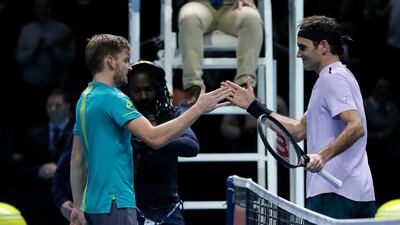 David Goffin of Belgium, left, shakes hands with Roger Federer of Switzerland after Goffin won their ATP World Tour Finals semi- final tennis match at the O2 Arena in London. Tim Ireland / AP Photo