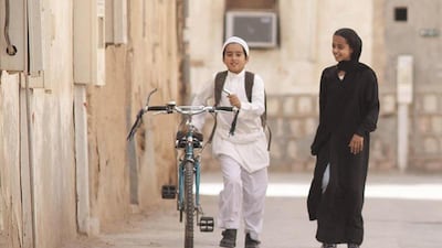 Wadjda (Waad Mohammed) wants a bicycle to race her friend Abdullah (Abdullrahman Al Gohani). Courtesy Razor Film Produktion