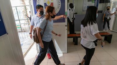 People from the Philippines prepare to cast their votes