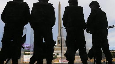 Soldiers block a road to prevent protesters from rallying against the May 22 military coup at Victory Monument in Bangkok on May 30, 2014. Diego Azubel / EPA