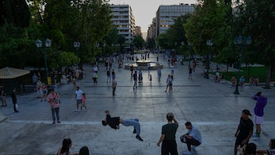 Young men dance is Syntagma square, central Athens.