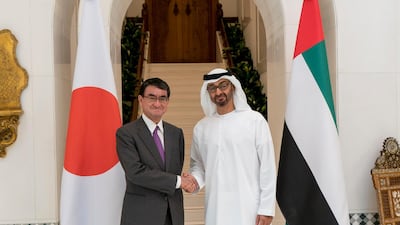 Sheikh Mohammed bin Zayed, Crown Prince of Abu Dhabi Deputy Supreme Commander of the Armed Forces (right), stands for a photograph with Taro Kono, the minister of foreign affairs of Japan (left), at the Sea Palace. Rashed Al Mansoori / Crown Prince Court