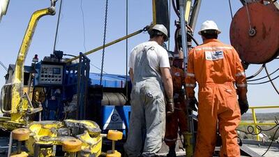 Workers at a rig in the North Texas Barnett Shale bed rock deposit in Texas. Matt Nager / Bloomberg