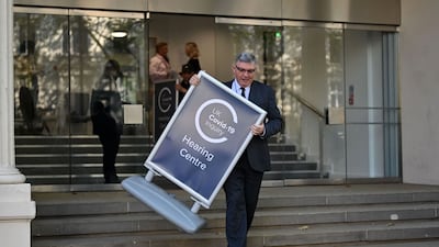 A sign put in place outside the venue for the inquiry. AFP
