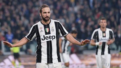 Gonzalo Higuain refuses to celebrate after scoring the winning goal for Juventus against his former club Napoli on Saturday night. Aleesandro Di Marco / EPA