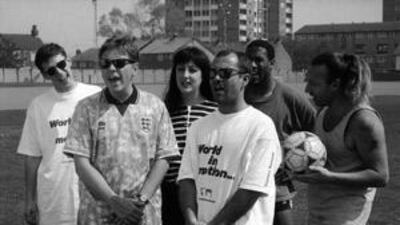 Members of the English rock group New Order with the comedian Keith Allen (second from right) and the footballer John Barnes (third from right) after they recorded World in Motion in 1990.