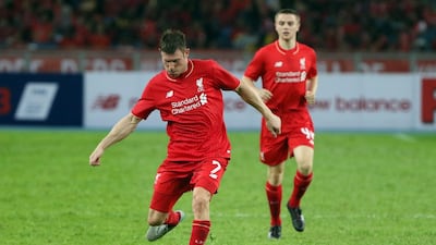 James Milner's steady production will be crucial to Liverpool's goal of reestablishing the club amongst the elite in 2015/16. How Foo Yeen / Getty Images