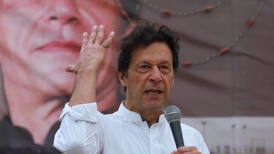 Imran Khan, chairman of the Pakistan Tehreek-e-Insaf (PTI), gestures while addressing his supporters during a campaign meeting ahead of general elections in Karachi, Pakistan, July 4, 2018. Reuters
